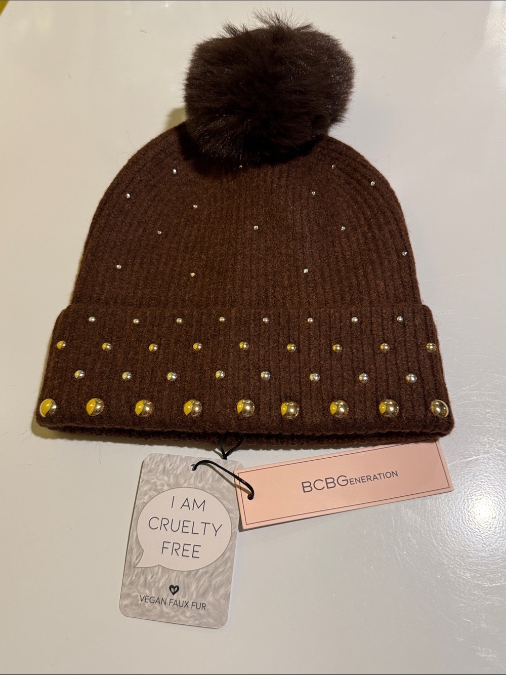 BCBGeneration Brown Beanie with Faux Fur Pom and Stud Embellishments